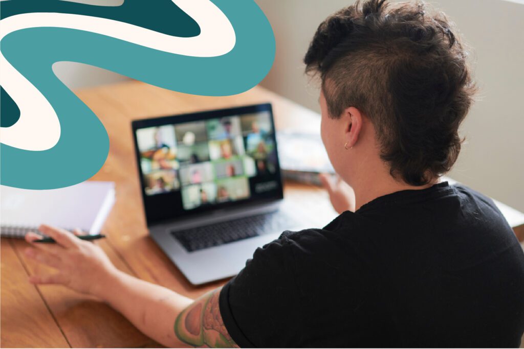 The Reach Club virtual coworking session with a person on a video call at their laptop.