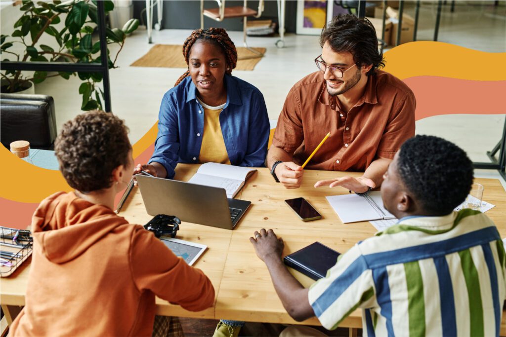 The Reach Club members collaborate during an in-person coworking session.